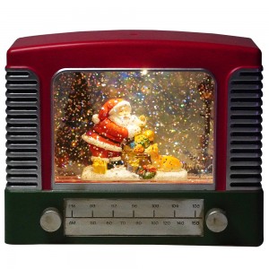 Kreative Weihnachtsszene in Radioform aus Kunststoff. Led-beleuchtete, wasserdrehende Weihnachtsschneekugel